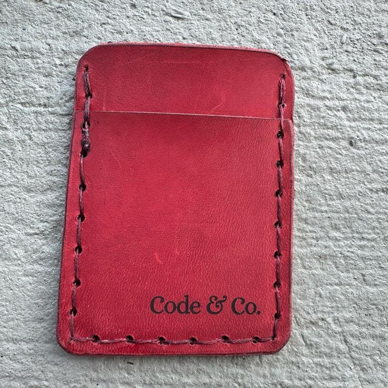 Handmade, hand sewn leather wallet card holder featuring red Hero